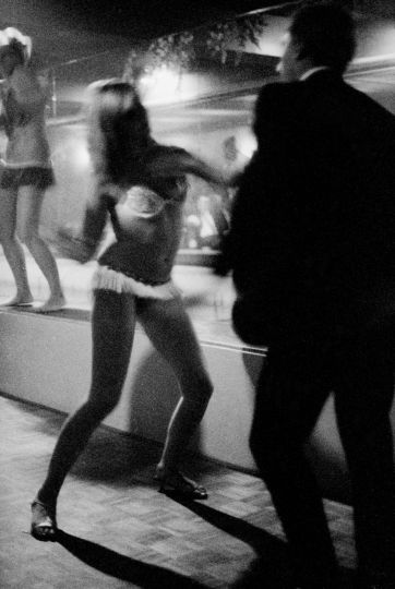 Go-go dancer dancing with customer, Kings Cross Robert McFarlane, 1965 ©Rennie Ellis Photographic Archive