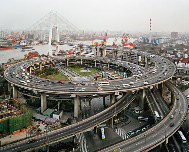 Industrial Beauty, Part 1. u201dThe beauty that Burtynski finds in environmentally ravaged landscapes, mammoth factory spaces, and sooty industrial sites is epic in scale and assaulting. Men's Journal published a fine portfolio of the work, including this photograph of the Nampu Bridge Interchange in Shanghai, China. Do we admire it, or do we fear it, or does this kind of beauty cut both ways?u201d Photo by Edward Burtynski, Men's Journal, April 2011