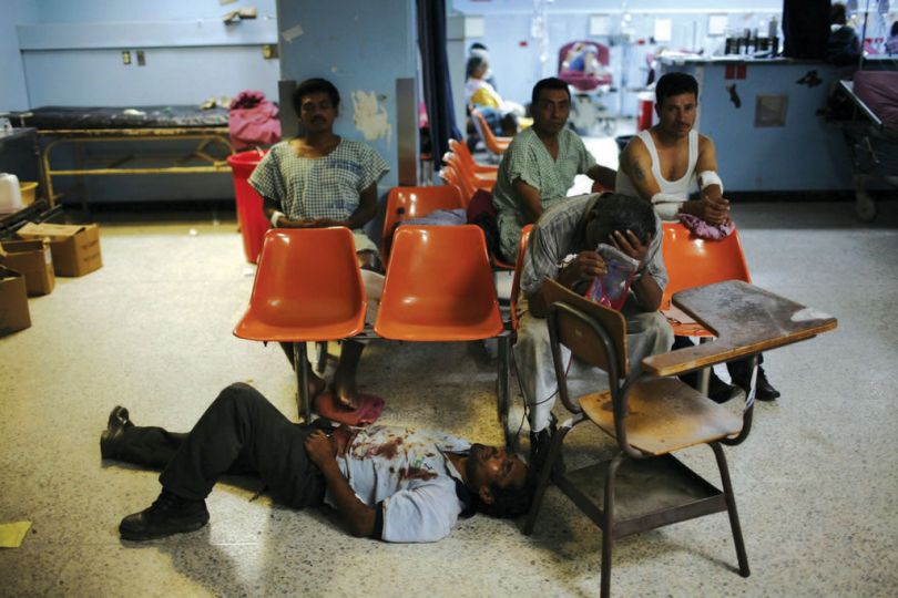 Rodrigo Abd, In this photo taken May 22, 2010, patients wait to receive medical attention at the emergency room of the San Juan de Dios hospital in Guatemala City.