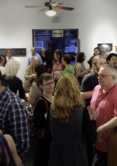 Debra Klomp Ching, Director, KLOMPCHING Gallery (center), at Photo-eye Galleries Opening Reception for Review Santa Fe