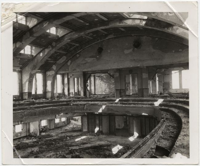 United States Strategic Bombing Survey, Physical Damage Division [Interior of Hiroshima City Hall auditorium with undamaged walls and framing but spalling of plaster and complete destruction of contents by fire], November 1, 1945rn© International Center of Photography