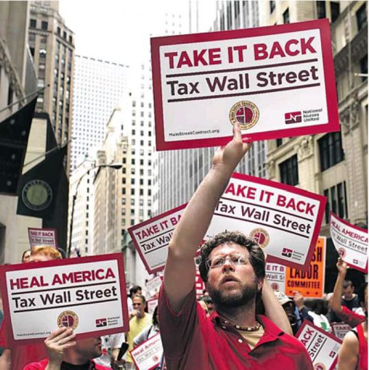 --Wall Street, nurses and other kinds of workers protest against the financial profits of the New York Stock Exchange and the cuts in the public sector.--rnThe Guardian, June 27.rnPhoto: Spencer Plat/Getty.