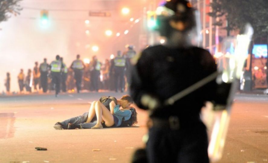 Sports, Part 1 ”Rich Lam’s shot of lovers embracing in the midst of angry Canadian hockey fans became an instant classic the moment it went viral. After the Vancouver Canucks lost the decisive Game 7 of a thrilling and brutal Stanley Cup championship series, the team’s fans went from avid to rabid, taking to Vancouver’s streets to loot local stores and set cars on fire. The anonymous couple inadvertently captured by freelancer Lam didn’t remain anonymous for long: After the picture was published, the lovers were identified by relatives, and within days Scott Jones and Alex Thomas were being interviewed on a morning television news show, joining a pantheon of famously photographed kissers.” Photo by Rich Lam/Getty Images, Washington Post