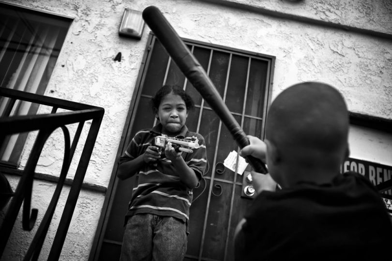 Albert, left, and Maddox play near where their brother was killed.  --He always talks about the guys that did it,-- Glee said of Albert.  --And he is always talking about the police. When are the police going to catch him?  Why haven't they caught him?. And we have to explain that to him the best we know how.--  Despite falling crime rates, a study showed that more than half of the children in the most violent neighborhoods in Los Angeles suffer from a condition akin to post-traumatic stress disorder. © Barbara Davidson / Los Angeles Times