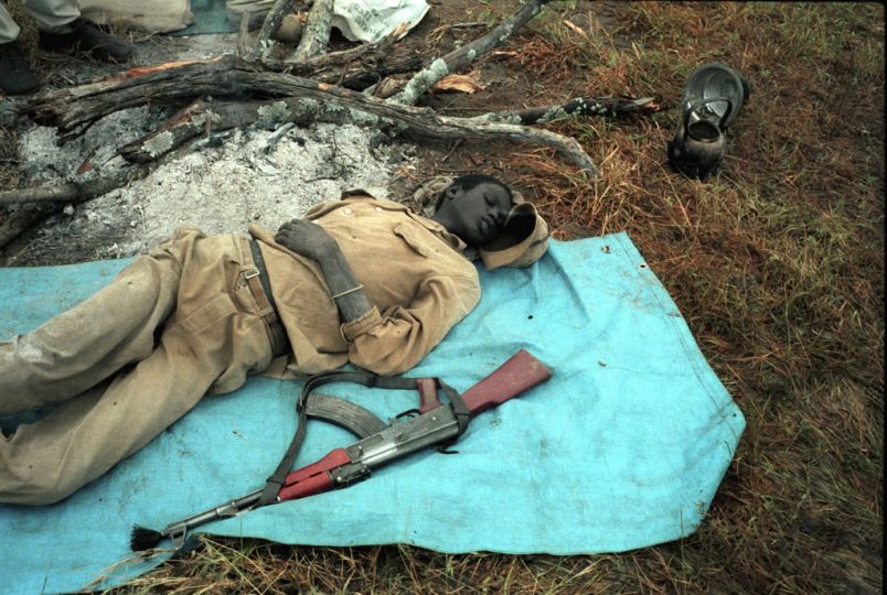 Southern Sudan, September, 1986.rnA member of the SPLA (Sudanese People's Liberation Army) sleeping. After having met with Col. John Garang in his stronghold, our group was stranded for several days in the bush due to heavy rains © Thomas Haley