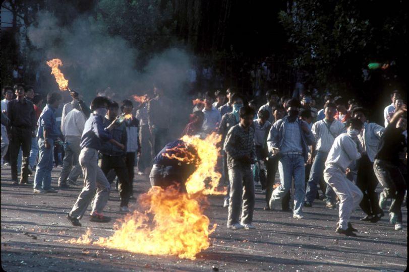 Seoul, South Korea. 1988.rnSouth Korean students demonstrating against the summer olympics being held in South Korea. A poorly corked Malotov Cocktail lit up a protesting student. The military regime of Chun Doo-whan gave way to the first democratically elected government in several decades shortly after this time © Thomas Haley