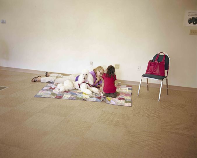 Reading to dogs, Bethlehem Area Public Library, Bethlehem, Pennsylvania, 2011 rn© Judith Joy Ross - Courtesy Pace/MacGill Gallery