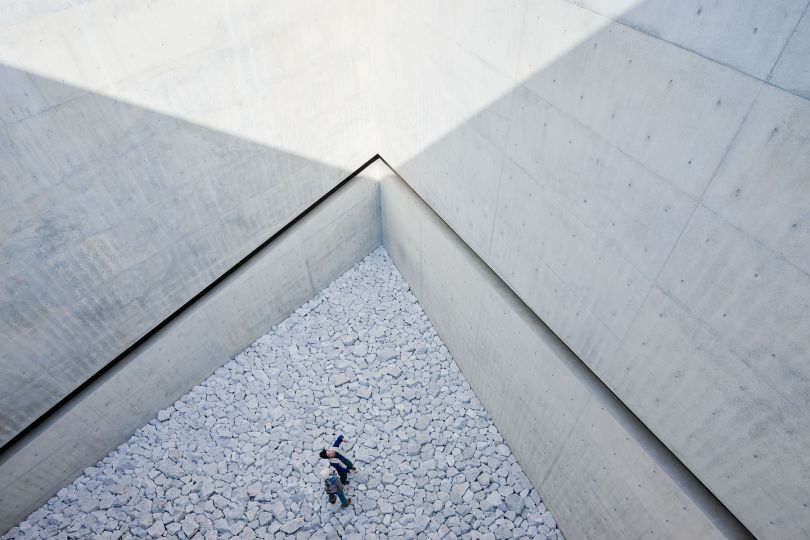 Using concrete, the main material employed in Tadao Ando's architecture, iron, glass, and wood, the design of the Chichu Art Museum is reduced to the very limit. Built entirely underground, the museum balances the contradictory qualities of non-monumentality and architecturality.