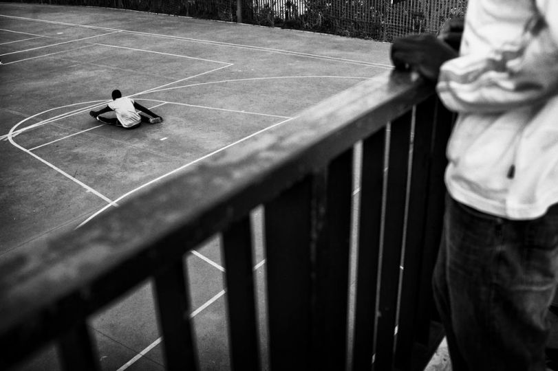 Spain, Ceuta, April 9 2012. A guest of CETI is doing stretching exercises before a football match. © Gianfranco Tripodo