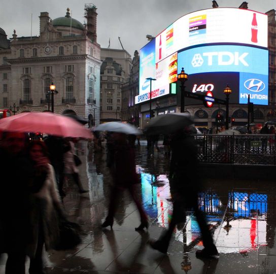 Piccadilly Circus at dusk beneath a rainy day, London, UK. © Manuel Cohen
