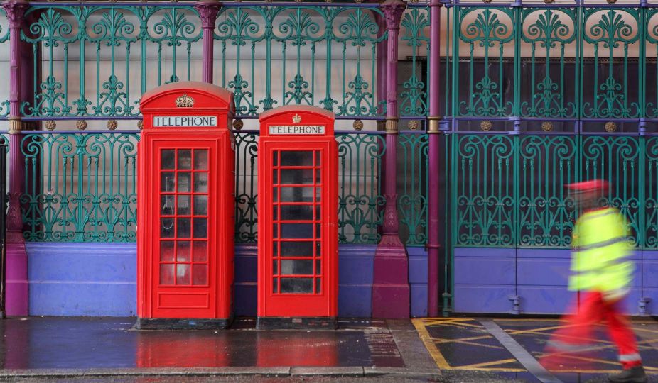 Red telephone boxes at the entrance of Smithfield or London Central Markets, 19th century, London, UK. © Manuel Cohen