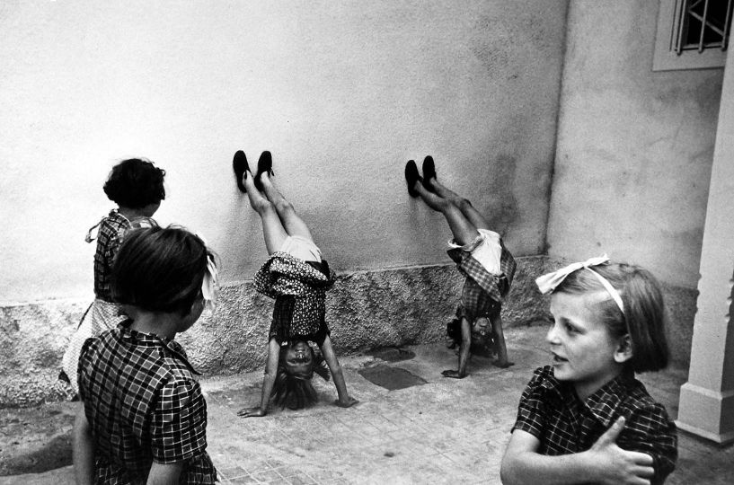 Children playing on the first day of school, Pilis, Poland, 1948 Gelatin silver print 8 3/4 X 13 inches --CHIM The Estate of David Seymour-- blindstamp on print recto. © Chim (David Seymour)/Magnum Photos