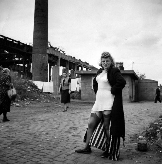 Prostitute near the Krupp works, Essen, 1947 Gelatin silver print; printed later 10 5/8 X 10 1/2 inches David Seymour/Magnum Photos credit stamp, Magnum Photo Library stamp, Magnum Portfolio Print stamp, and annotations in pencil on print verso. © Chim (David Seymour)/Magnum Photos