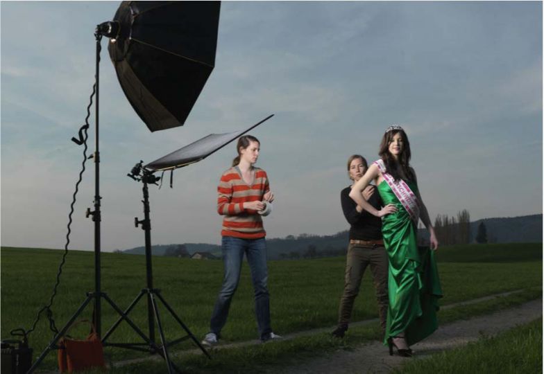 17th of April, Wangi, Switzerland, From the stage of the Zurich Opera to the provincial countryside. Our assistant Victoria and Monika are getting Lisa Schneider ready for a shoot. Lisa has just been elected Miss Eastern Switzerland and this is one of her first shoots in her new role as the prettiest woman of Switzerland's rural East. © Braschler/Fischer
