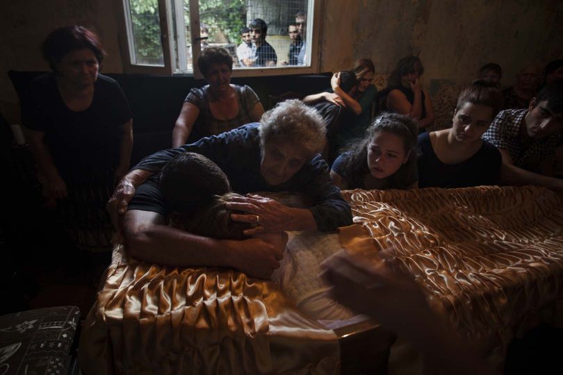 A young pregnant woman Maro Guloyan's funeral. Her husband's family insists that she committed suicide, but the bruises the fingers on her neck speak for themselves.
During last year six women were killed in Armenia according to police © Anahit Hayrapetyan