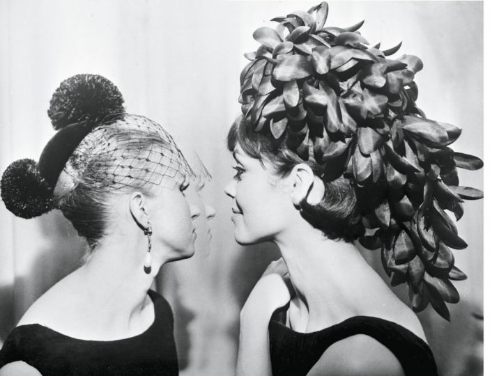 Black velvet chignon-cover with two ostrich-feather pompoms, 1965. Cascade of petals in black organza, 1965. Topfoto. 