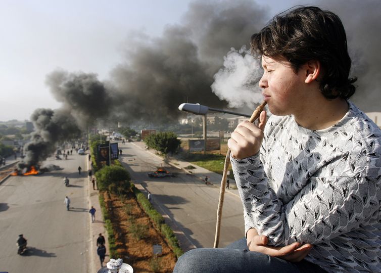 © Marwan Tahtah, Lebanese photographer, 2007rnSimilarly to everyone else, I've heard about the war from my family first, and like everybody else, I later on learned that it was absurd. And for us, the new generation who did not experience the war, somehow the memory of it leaves us with a bitter aftertaste. Perhaps the photo I captured on that dark Beirut morning in 2007 is the truest representation of the war's absurdity.rn