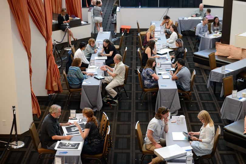 In the portfolio review area attendees met with curators, editors, publishers and gallery owners.rn 6928 -