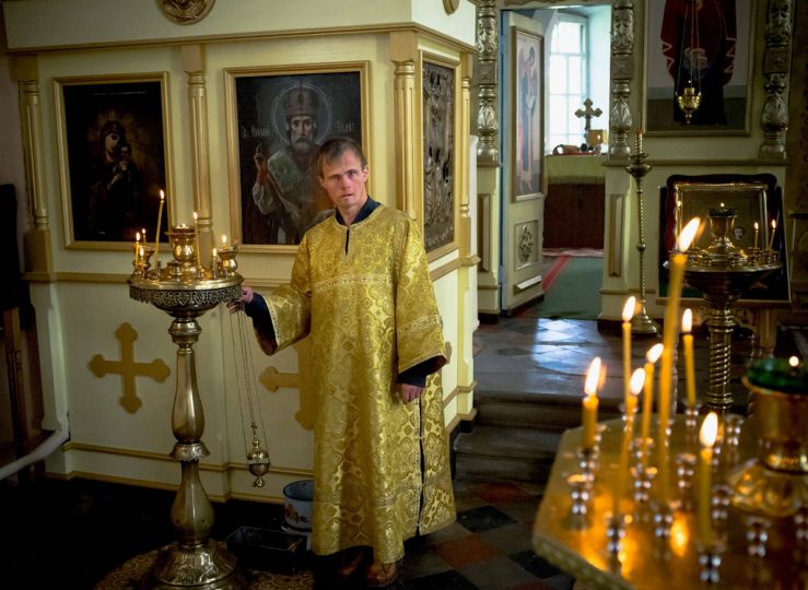 In the village church, a patient who assists the priest every weekend. Summer of 2012, Elatma, Ryazan region, Russia. © Anastasia Rudenko 2015 Winner of the Canon Female Photojournalist Award supported by ELLE Magazine
