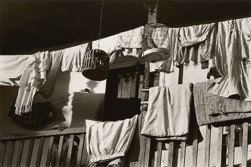 Bhupendra Karia, Birdcage and Saris on Porch, Sankheda, 1967 Vintage Silver print