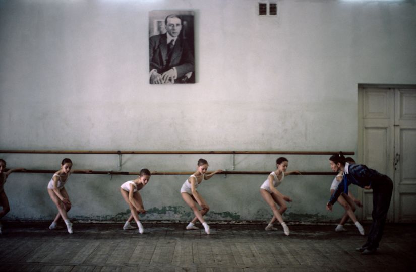 Arthur Elgort, Ballet Class
Photographer Arthur Elgort travelled to Russia in 1990 for Vogue to capture this image.  Here, the muted colors and composition of the ballerinas under the watchful eye of Sergei Prokofiev, a wonderful expression of Elgort’s background as a painter and his love of dance.  
