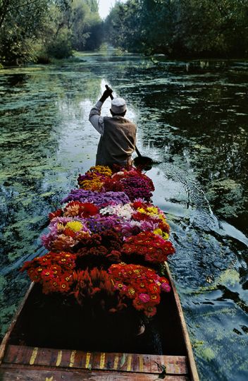 INDIA. Jammu and Kashmir. Srinagar. 1999. Flower Seller at Dal Lake.