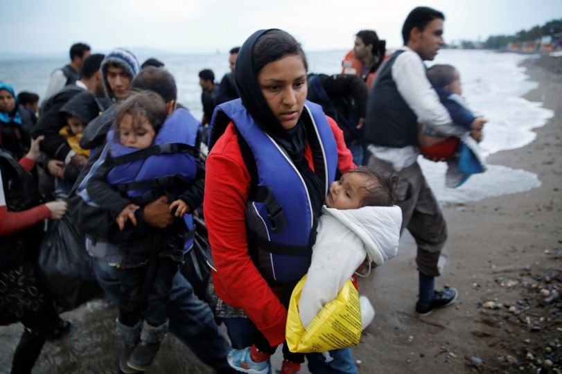 Afghan migrants land at a beach on the Greek island of Kos after crossing on a dingy a part of the south-eastern Aegean Sea between Turkey and Greece early May 27, 2015.REUTERS/Yannis Behrakis