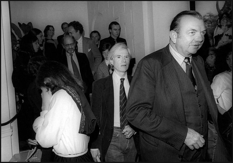 Andy Warhol (center) on the International Center of Photography stairway © Orin Langelle