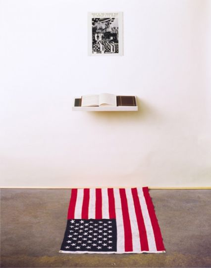 What is the Proper Way to Display a U.S. Flag, 1988; Silver gelatin print, US flag, book, pen, shelf, audience; 80 x 28 x 60 inches © Dread Scott