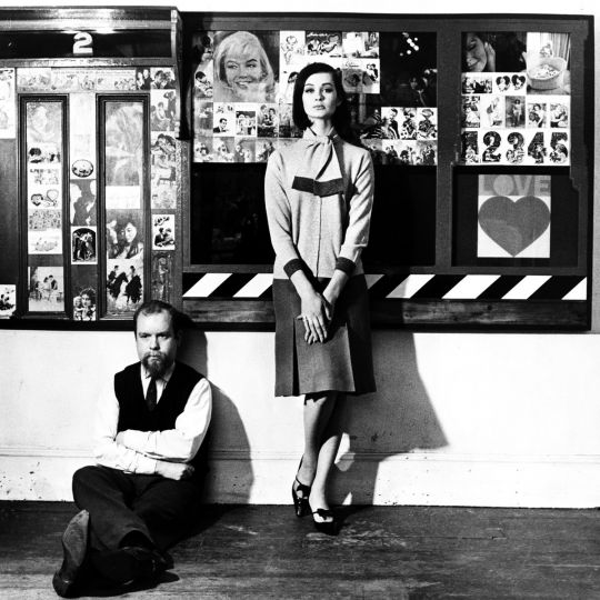 Peter Blake with model Marie-Lise Gres at the ‘Love Wall’ in his studio, London, 1961  © Elsbeth Juda / Victoria and Albert Museum, London 