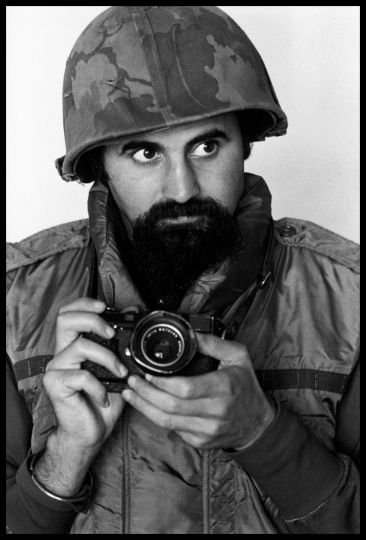 South Vietnam, 1973. Photographer ABBAS wears helmet and flack-jacket while covering the war © A. Abbas/Magnum Photos