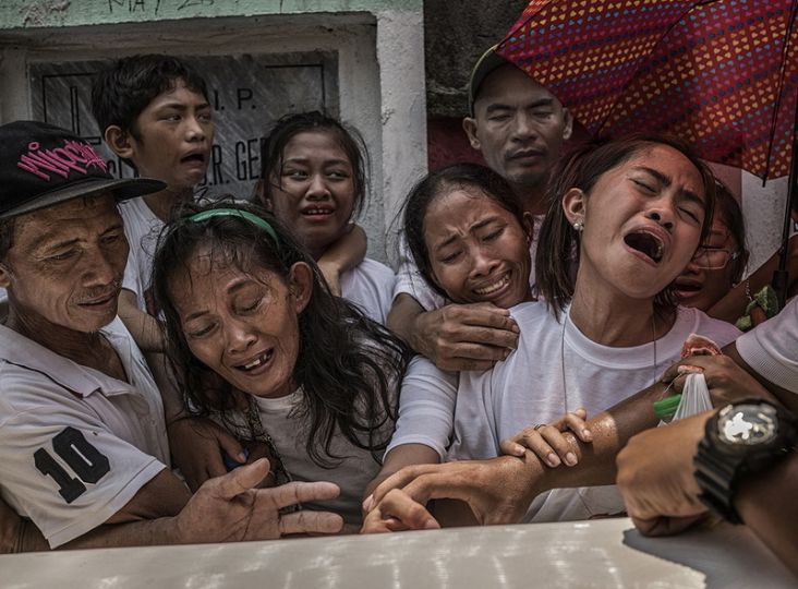 Family members of Junmar Abletes, killed in an extrajudicial killing by black-masked assassins in President Duterte's so-called 
