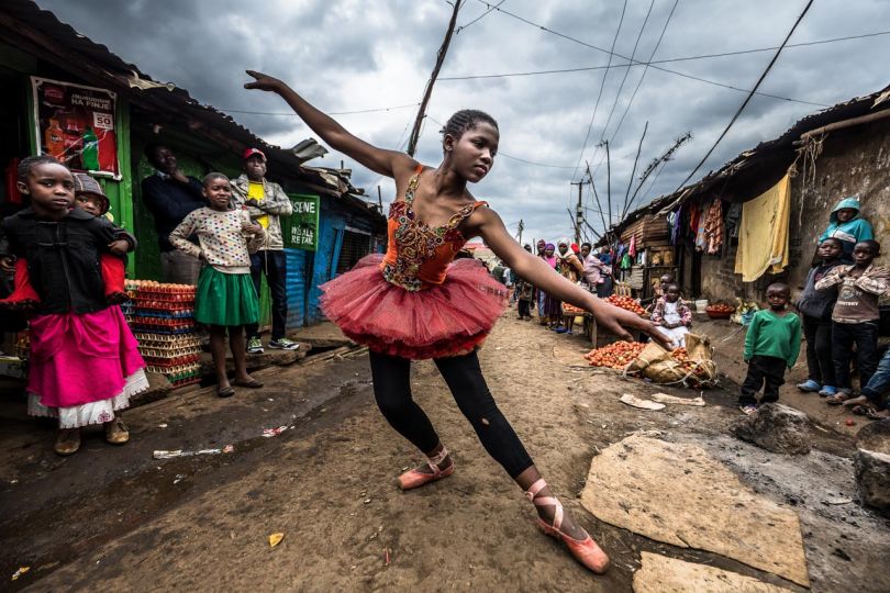 Kibera: Stories From Within © Brian Otieno 1st Place - Elsie Ayoo, 16, a young passionate ballet dancer, trains along a busy street corner in Kibera. Ballet dancing is being taught at schools in Kibera through an arts program run by charities Anno’s Africa and One Fine Day, providing alternative Arts and education to children in Kenya.