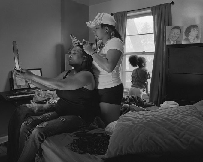 LaToya Ruby Frazier Shea doing crochet braids in her cousin Andrea’s hair for Andrea’s daughter’s wedding, 2016 / 2017 Gelatin silver print 20 x 24 inches All images courtesy the artist and Gavin Brown's enterprise, New York / Rome.