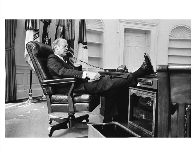 AUGUST 12, 1974 
Gerald Ford gets down to business in an Oval Office recently emptied of President Nixon’s personal effects, and not yet replaced by Ford’s mementos. (Photo by David Hume Kennerly/Gerald R. Ford Presidential Library)