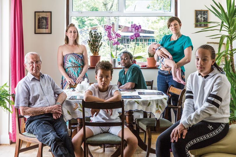 G.B. London. Family of Annabella Dudziec (blonde hair) who is British born Polish, her children (from a previous marriage to a Rwandan father), Izabella Dudziec-Mabasi and Lorenzo Dudziec-Mabasi. Annabella's Polish father Antoni Dudziec, her sister Magda Dudziec holding her baby Kuba Lois Azamat, and Annabella's partner Nasir Brown who is British born with Jamaican and Guyanese parents. © Chris Steele-Perkins from The New Londoners / Dewi Lewis Publishing