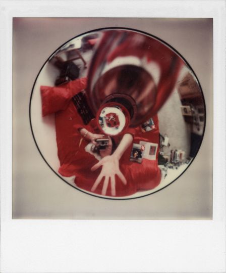 Self-portrait in lamp, Munich, 1977 Polaroid SX-70 © Robby Müller Estate Courtesy Annet Gelink Gallery and Robby Müller Estate