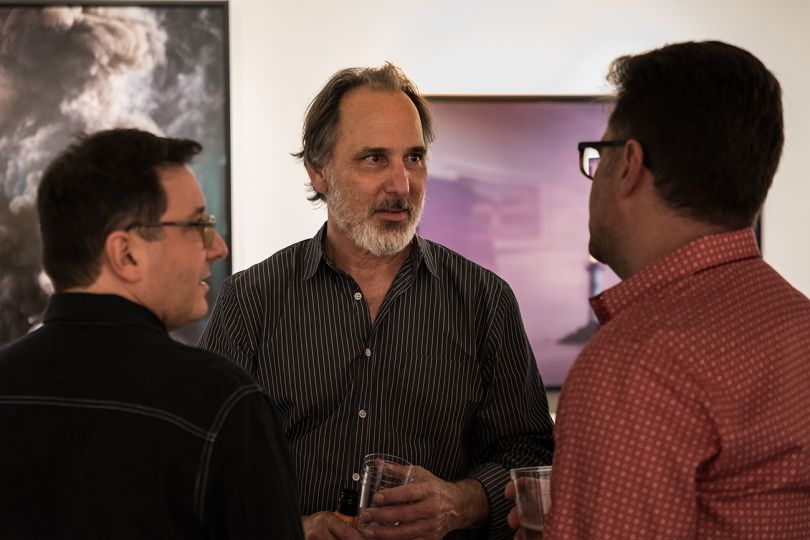 Paul Kopeikin talking with visitors at the 25th anniversary celebration © Andy Romanoff