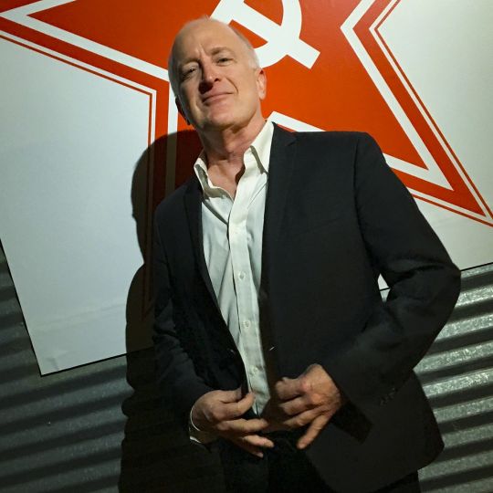 Daniel Miller standing outside his gallery at the opening of Soviet Photography © Andy Romanoff
