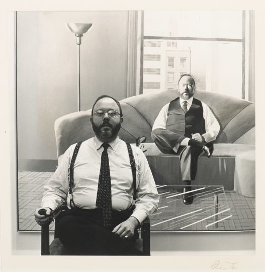 Lot 260 : BEATON, Cecil (British 1904 - 1980). Henry Geldzahler in front of his portrait by David Hockney, c. 1969.