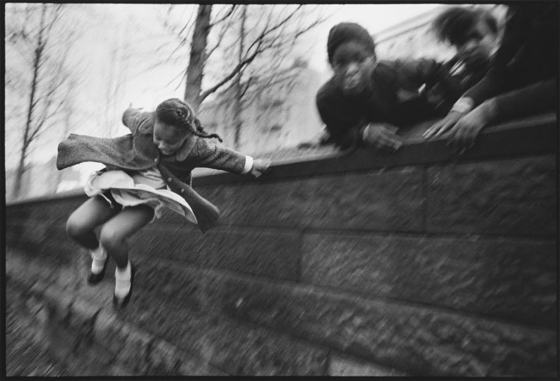 Mary Ellen Mark, Girl Jumping over a Wall, Central Park, New York City, 1967 (printed later); Gelatin silver print, 16 x 20 in.; NMWA, Gift of Jill and Jeffrey Stern; Photo by Lee Stalsworth; © Mary Ellen Mark/The Mary Ellen Mark Foundation