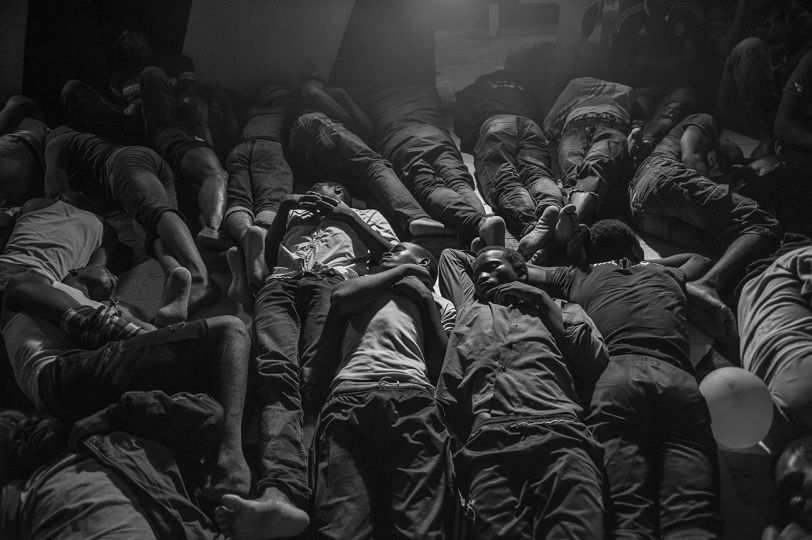 Rescued migrants spend the night on the deck of the MSF Bourbon Argos search and rescue ship. After rescuing 95 people from a sinking rubber dinghy, the Argos received a transfer of 206 migrants by Italian ships and is now sailing towards Italy. 21 August 2015 © Francisco Zizola