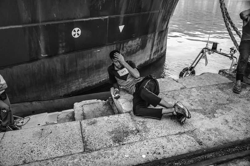 A suspect smuggler waits the result of the investigation carried out by the Italian Police upon the arrival of the Bourbon Argos ship in the port of Vibo Valentia, Italy, 28 August 2015. © Francisco Zizola