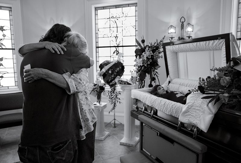 Cheryl Schmidtchen, 67, being consoled at the funeral for her granddaughter Michaela Gingras in Manchester, N.H., on September 17th, 2017. Gingras, a heroin user, was 24. © James Nachtwey for TIME – Courtesy The Bronx Documentary Center
