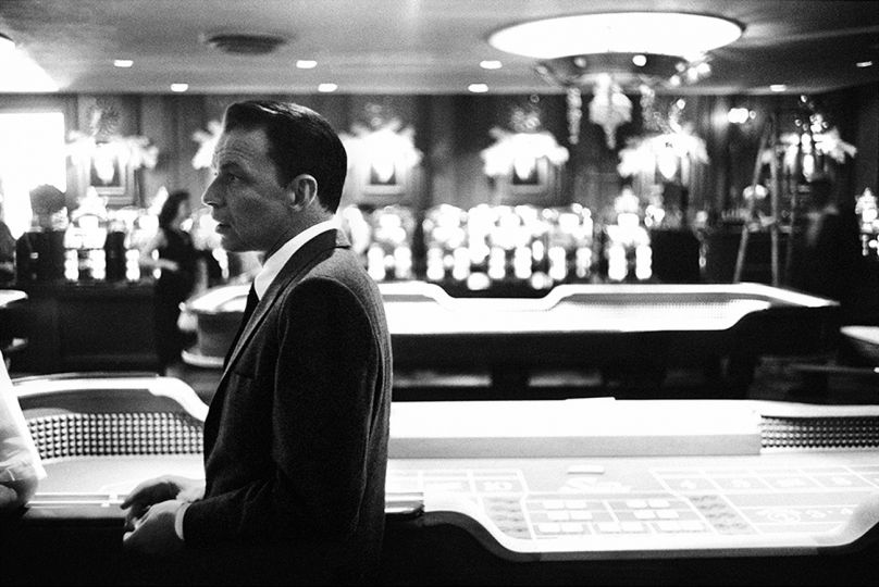 Frank Sinatra in front of craps tables at the Sands Hotel, Las Vegas, 1960 © Bob Willoughby - Courtesy Fahey Klein Gallery