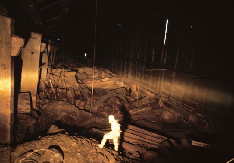 Victoria Ivleva, Dosimetrist Yuri Kobsar climbs radioactive debris inside the fourth reactor at Chernobyl nuclear power plant, 1991 © Victoria Ivleva
