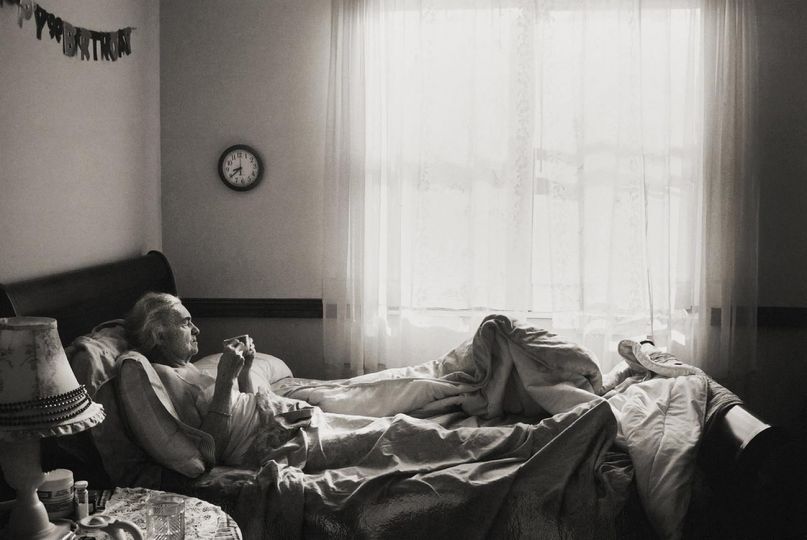Madje Steber enjoys her morning coffee in her bedroom at Midtown Manor where she resides in Hollywood, Fl. Madje is suffering from dementia and lives near her daughter, Maggie Steber, who has photographed her mother through the process of the memory loss. © Maggie Steber - Courtesy Leica Gallery Los Angeles
