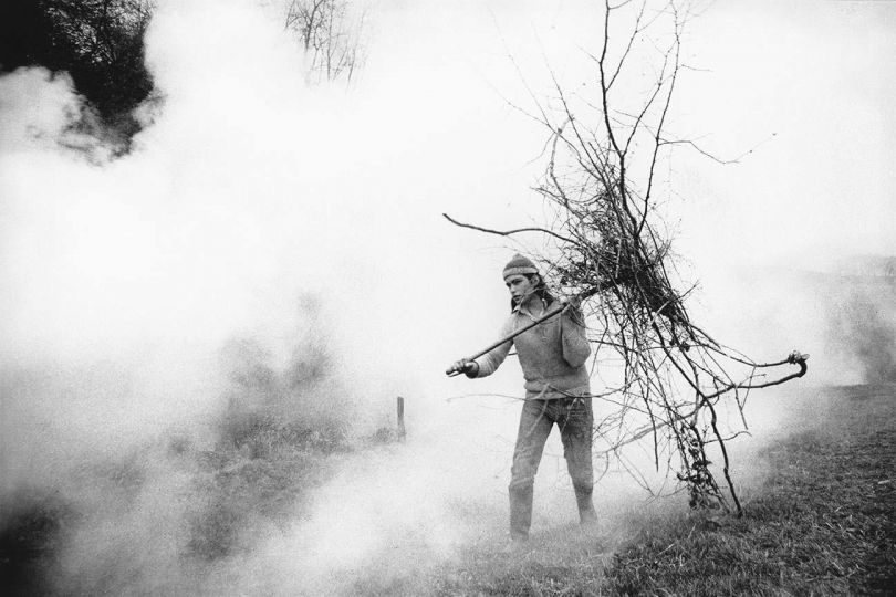 Derek carrying sticks for the fire, Beaford, 1971 © Roger A. Deakins - Courtesy The Hulett Collection 