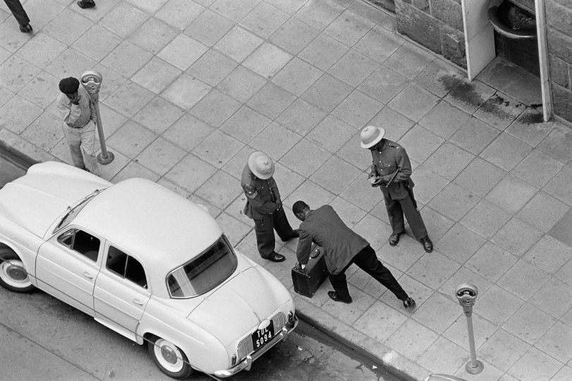 Ernest Cole - South Africa, 1960s. Pass raid outside Johannesburg station. Every African must show his pass before being allowed to go about his business. From the chapter „Police & Passes“ © Ernest Cole / Magnum Photos
