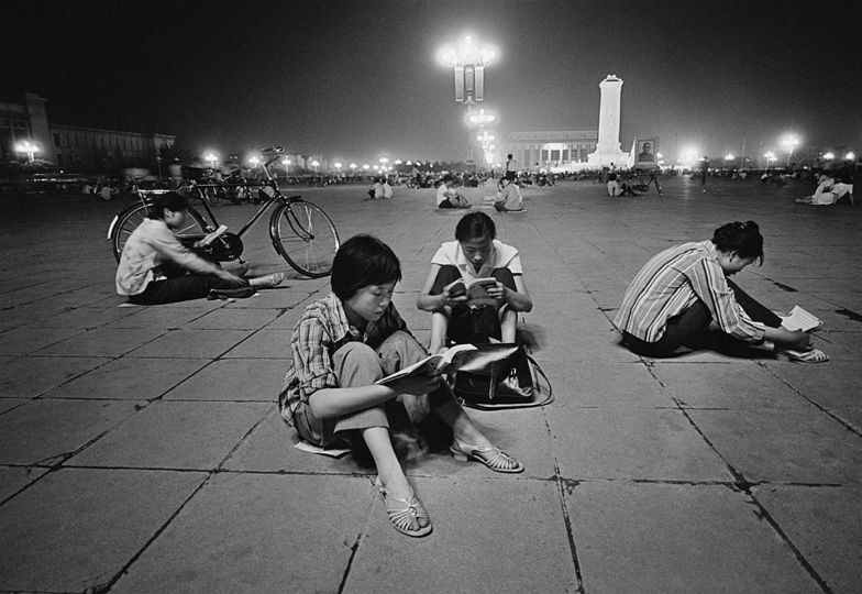 Students studying under the bright lights of Tiananmen Square. Beijing, 1981. © HS Liu 